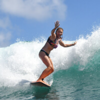 Michelle, expedition host at Tidal Flow Travel,surfing