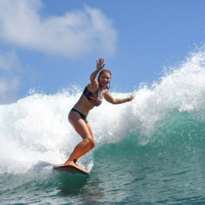 Michelle, host of the San Cristóbal Surf and Nature Connection Retreat, surfing